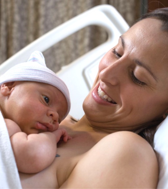 Babies need lots of skin-to-skin time with mom and dad in the hospital and at home.